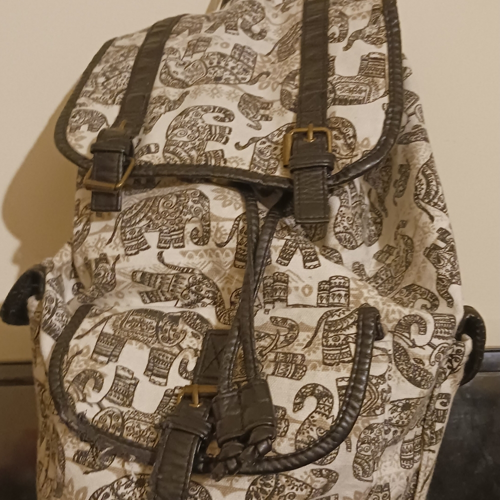 Claire's black/white elephant print backpack.
